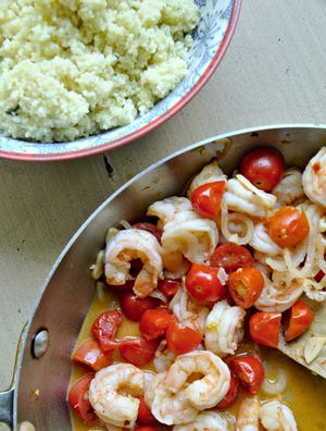Garlicky shrimp are paired with sweet cherry tomatoes in this light summer dish. 

Pittsburgh Post-Gazette/TNS