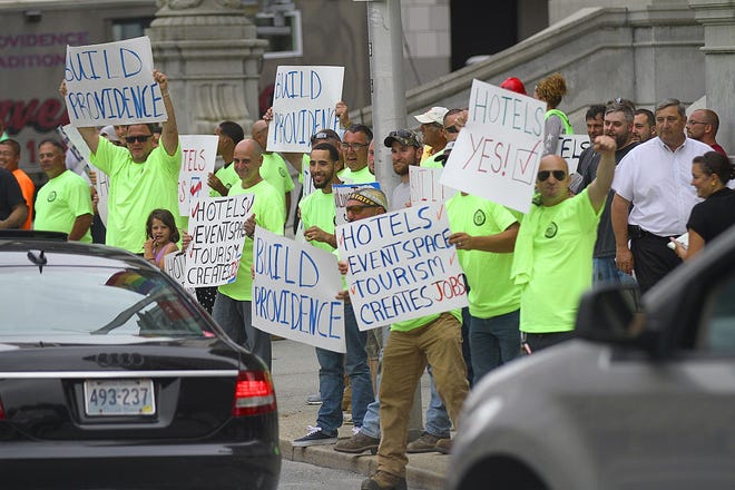 Construction workers seek support Thursday on Dorrance Street, in front of Providence City Hall, for a tax stabiliation plan they hope will lead to jobs on constructions projects on former Route 195 land. The Providence Journal/Glenn Osmundson