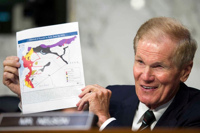 Senate Armed Services Committee member Sen. Bill Nelson, D-Fla., holds-up a map of Syria while he questions Marine Corps Commandant Gen. Joseph Dunford, Jr. during his confirmation hearing to become the Chairman of the Joint Chiefs of Staff, on Capitol Hill in Washington, Thursday, July 9, 2015. (AP Photo/Cliff Owen)