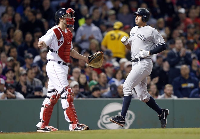 Alex Rodriguez scores as the Red Sox's Blake Swihart, left, looks to the outfield during a New York sweep in May. Boston needs to win at least one, if not two, against the Yankees this weekend to enter the All-Star break with momentum. AP FILE PHOTO