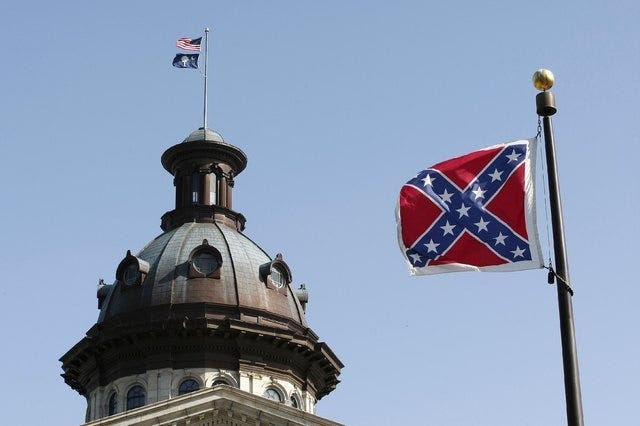 A Confederate flag flies at the base of a confederate memorial in front of the South Carolina State House in Columbia, South Carolina on July 4, 2015. (REUTERS/Tami Chappell)