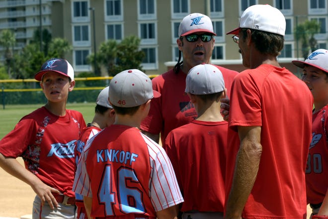 Riptide Coaches Scott Hemond and Mike Clements huddles up the team before taking the field Wednesday.