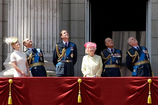 Britain's Queen Elizabeth II, fourth left, and from left, Sophie Countess of Wessex, Prince Edward, Prince William, her husband Prince Philip, and Prince Andrew watch a Royal Air Force flypast to mark the 75th anniversary of the Battle of Britain from a balcony at Buckingham Palace, in London, Friday, July 10, 2015. On July 10, 1940, during World War II, the Battle of Britain began as the Luftwaffe started attacking southern England. (AP Photo/Matt Dunham)