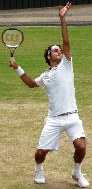 Roger Federer, seen serving at Wimbledon during his 2009 run to the title there, is the subject of a new hologram at the International Tennis Hall of Fame in Newport, Rhode Island.