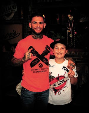 Cody Garbrandt will be walked into the Octagon at UFC 189 tonight by 9-year-old Maddux Maple, who has battled leukemia to remission.