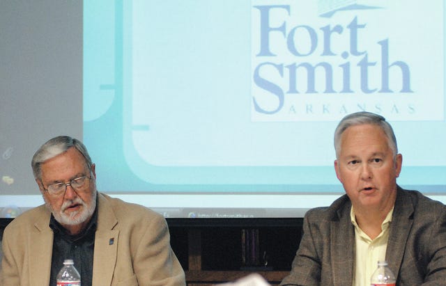 TIMES RECORD FILE PHOTO    Fort Smith City Administrator Ray Gosack, right, and Mayor Sandy Sanders take part in a budget review meeting Nov. 14, 2013. Gosack announced Friday he is retiring.