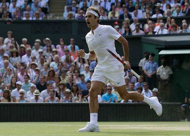 Roger Federer of Switzerland celebrates winning the 1st set against Andy Murray of Britain in their men's singles semifinal match at the All England Lawn Tennis Championships in Wimbledon, London, Friday July 10, 2015.