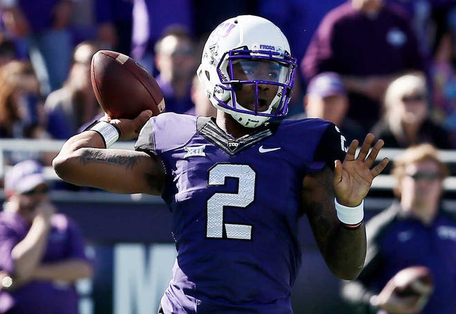 TCU quarterback Trevone Boykin (2) looks to throw to a receiver during the first half of an NCAA college football game against Iowa State at Amon G. Carter Stadium, Saturday, Dec. 6, 2014, in Fort Worth, Texas. (AP Photo/Brandon Wade)