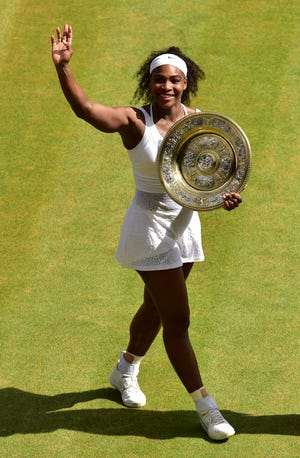 Serena Williams of the United States gestures after winning the women's singles final against Garbine Muguruza of Spain, at the All England Lawn Tennis Championships in Wimbledon, London, on Saturday. (Dominic Lipinski/Pool Photo via AP)