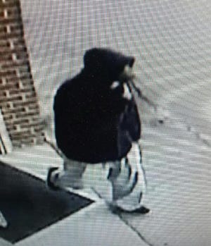 The Dover Police Department released this image taken from surveillance video of a suspect wanted in a robbery at the CVS Pharmacy on Central Avenue Friday evening. Courtesy photo