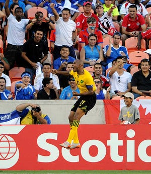 Jamaica midfielder Rudolph Austin (17) celebrates his game-winning goal in stoppage time during the second half of a CONCACAF Gold Cup soccer match against Canada, Saturday, July 11, 2015, in Houston. Jamaica won 1-0. (AP Photo/Eric Christian Smith)