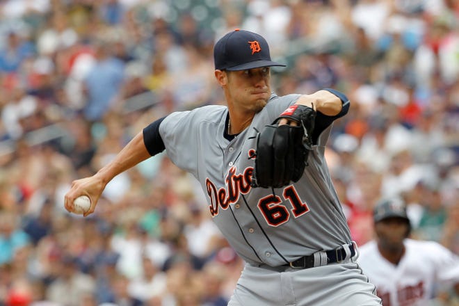 Detroit Tigers starting pitcher Shane Greene (61) delivers to the Minnesota Twins during the first inning of a baseball game in Minneapolis, Sunday, July 12, 2015. (AP Photo/Ann Heisenfelt)