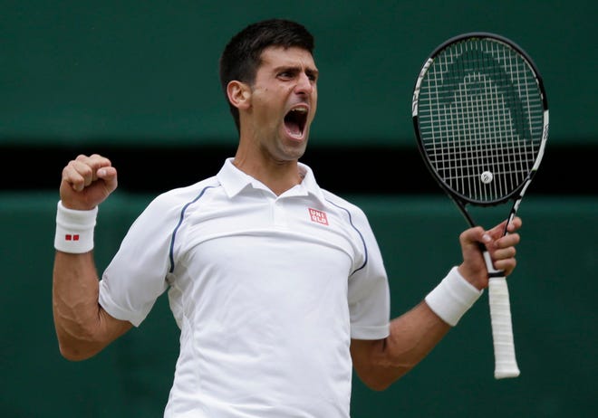 Novak Djokovic celebrates after beating Roger Federer in the men's final at the All England Lawn Tennis Championships in Wimbledon, London on Sunday. Djokovic won the match 7-6, 6-7, 6-4, 6-3. AP photo