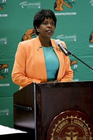 FAMU President Elmira Mangum, Ph. D., annouce the new Athletic Director Kellen Winslow, Sr. to the media during a press conference at the Al Lawson, Jr. Multipurpose Center on the campus of FAMU on April 9, 2014 in Tallahassee, Florida. Winslow played nine seasons (1979-87) with the San Diego Chargers. He earned All-Pro honors five times and is considered by many as one of the best tight ends in NFL history. He is a member of the Pro Football and College Football Hall of Fame. (AP Photo/Don Juan Moore)