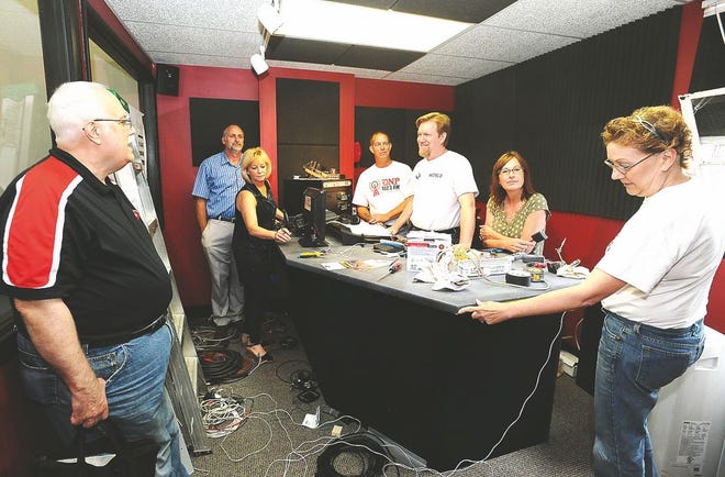 Dover-New Philadelphia Educational Broadcasting board members and volunteers continue work on the studio of the new nonprofit radio station WPDE “DNP 102.3”, which will begin broadcasting Monday from the W. Third St. studio in Dover.