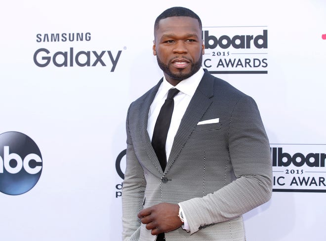 In this May 17, 2015 file photo, 50 Cent arrives at the Billboard Music Awards at the MGM Grand Garden Arena in Las Vegas. Someone else's sex tape is proving to be costly for 50 Cent: A jury ordered the rapper-actor Friday, July 10, 2015, to pay $5 million to a woman who said he acquired a video she made with her boyfriend, added himself as a crude commentator and posted it online without her permission. Born Curtis Jackson, 50 Cent burst to the fore of gangsta rap with 2003's "Get Rich or Die Tryin,'" its lead single, "In Da Club," and a tough life story that included having been shot nine times. (Photo by Eric Jamison/Invision/AP, File)