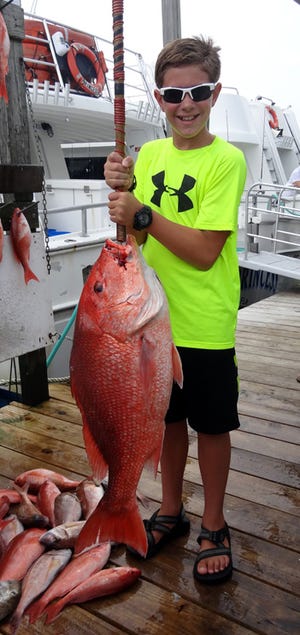 Easton Gray, 11, of Dalton, Ga. pulled in the largest red snapper on the Backdown 2 on Monday with Capt. Gary Jarvis. His catch weighed 24 pounds and measured 35 ½ inches long. This was Gray’s first time deep sea fishing.