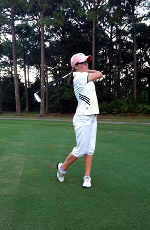 Madison Tenore, who also plays golf for the Destin Marlins, tees off in the golf tour Classic in Niceville.