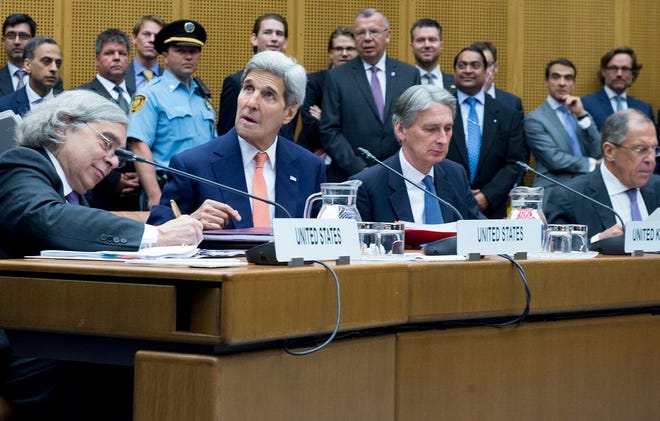 US Secretary of Energy Ernest Moniz, US Secretary of State John Kerry, British Foreign Secretary Philip Hammond and Russian Foreign Minister Sergey Lavrov attend the last plenary session at the United Nations building in Vienna, Austria, Tuesday, July 14, 2015. After 18 days of intense and often fractious negotiation, diplomats Tuesday declared that world powers and Iran had struck a landmark deal to curb Iran's nuclear program in exchange for billions of dollars in relief from international sanctions, an agreement designed to avert the threat of a nuclear-armed Iran and another U.S. military intervention in the Muslim world.