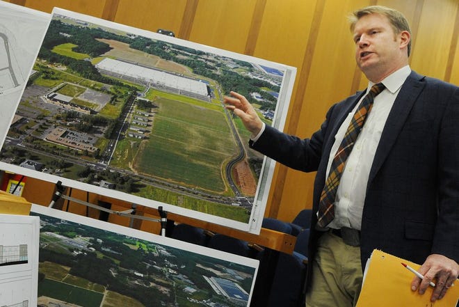 Engineer Richard Burrow talks about the proposed Amazon facility in Fall River, showing an aerial view of a very similar facility in Windsor, Connecticut.
