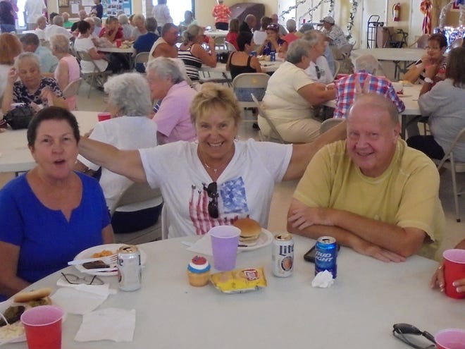 Jean Blair, Nancy Janish, and Frank Kreager at the Bay Indies Independence Day Celebration. 
PHOTO PROVIDED BY KATIE DOAN