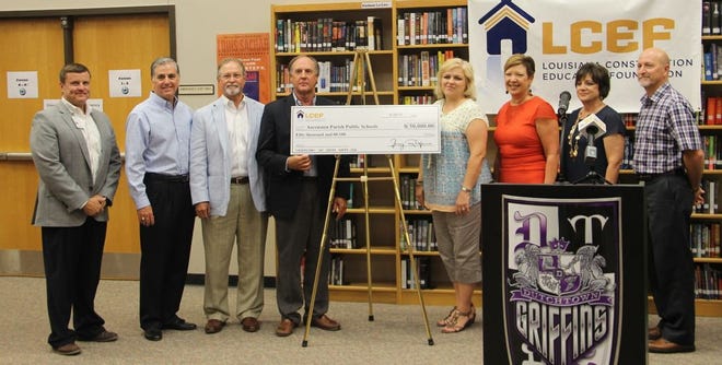 Ascension Parish school system members and LCEF representatives display a check for a $50,000 grant awarded to Ascension Parish schools for a new electrical program of studies.