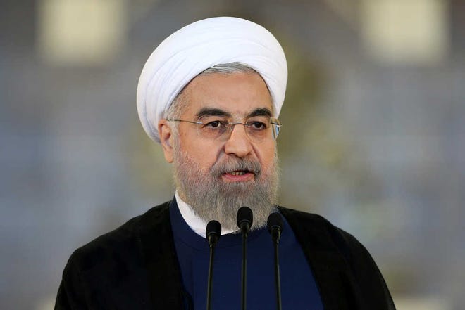Iran's President Hassan Rouhani addresses the nation in a televised speech after a nuclear agreement was announced in Vienna, in Tehran, Iran, Tuesday, July 14, 2015. After long, fractious negotiations, world powers and Iran struck a historic deal Tuesday to curb Iran's nuclear program in exchange for billions of dollars in relief from international sanctions - an agreement aimed at averting the threat of a nuclear-armed Iran and another U.S. military intervention in the Middle East. (AP Photo/Ebrahim Noroozi)