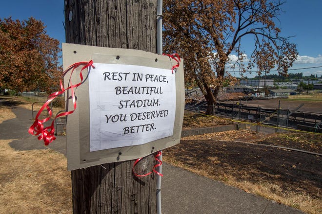 A sign memorializing Civic Stadium is tacked to a utility pole along Willamette Street. (Brian Davies/The Register-Guard)