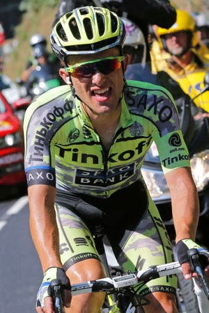 Stage winner Poland's Rafal Majka rides solo during the eleventh stage of the Tour de France cycling race over 188 kilometers (116.8 miles) with start in Pau and finish in Cauterets, France, Wednesday, July 15, 2015. (AP Photo/Christophe Ena)