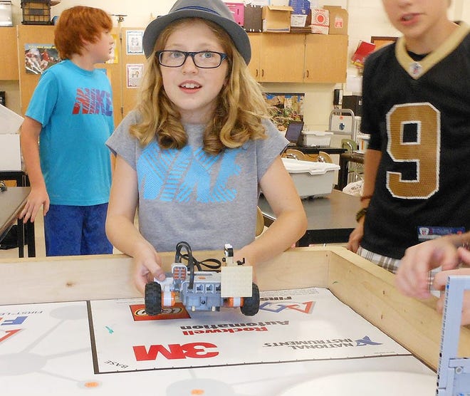 Gianna Lyon places a robot on a table as part of the Lego Robotics Camp at Dolgeville Middle School on Thursday. TIMES PHOTO/STEPHANIE SORRELL-WHITE