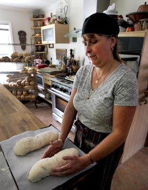 (John Clark/The Gazette)  Corinne Brandhorst, owner of Ladybug Farms & Bakery, makes bread that will be available at the Bessemer City Farmers Market Saturday.