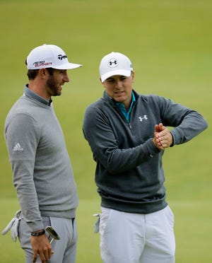 United Statesí Jordan Spieth, right, and United Statesí Dustin Johnson chat after finishing on the 18th green during the first round of the British Open Golf Championship at the Old Course, St. Andrews, Scotland, Thursday, July 16, 2015.