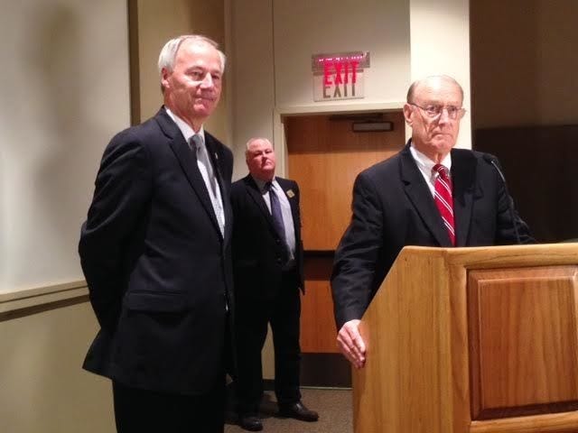 John Lyon • Arkansas News Bureau
Gov. Asa Hutchinson, from left, state Game and Fish Commission Director Mike Knoedl and new Commissioner Joe Morgan take part in a news conference announcing Morgan’s appointment at the commission’s Little Rock headquarters Wednesday, July 15, 2015.