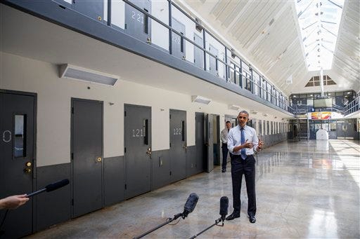 President Barack Obama speaks at the El Reno Federal Correctional Institution in El Reno, Okla., Thursday, July 16, 2015. As part of a weeklong focus on inequities in the criminal justice system, the president will meet separately Thursday with law enforcement officials and nonviolent drug offenders who are paying their debt to society at the El Reno Federal Correctional Institution, a medium-security prison for male offenders near Oklahoma City. (AP Photo/Evan Vucci)