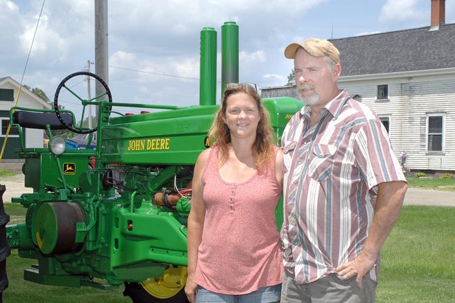 Tom and Lisa Raitt, caretakers of the Raitt Homestead Farm Museum on State Road in Eliot. The farm is the home of the annual Eliot Antique Tractor and Engine Show. Photo by Ralph Morang