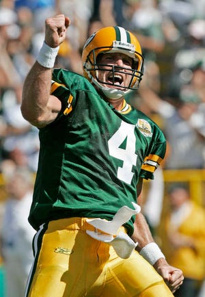 Green Bay Packers quarterback Brett Favre reacts after throwing a touchdown pass to Bubba Franks during a against the San Diego Chargers in 2007 in Green Bay, Wis. Favre is scheduled to be inducted today into the Packers Hall of Fame. (AP Photo/Morry Gash)