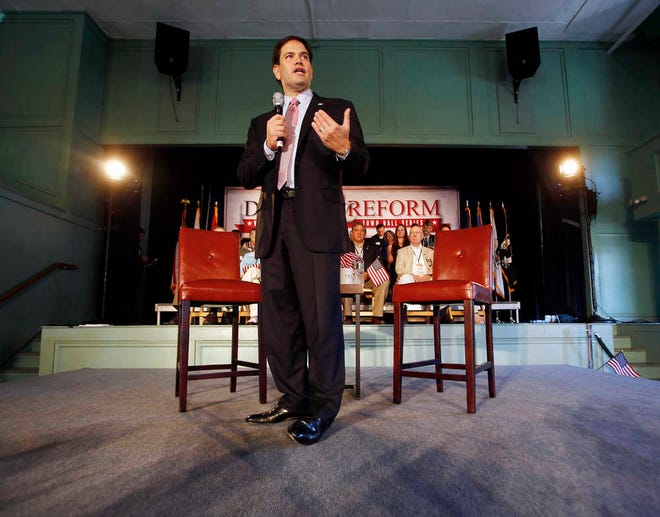FILE - In this June 25, 2015 file photo Republican presidential candidate, Sen. Marco Rubio, R-Fla. speaks in Exeter, N.H. Unhappy with President Barack Obama's nuclear deal with Iran? The solution is as simple as putting a Republican in the White House, according to GOP candidates who have vowed to rescind the agreement, some on their first day in office. (AP Photo/Jim Cole, File)