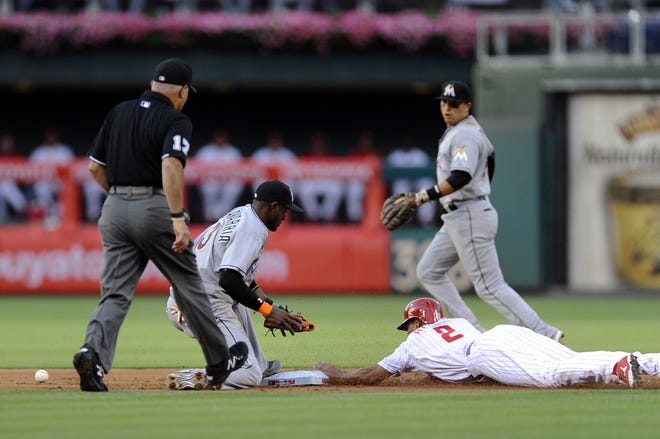 The Phillies' Ben Revere steals second base in front of the Marlins' Adeiny Hechavarria during the first inning Saturday, July 18, 2015.