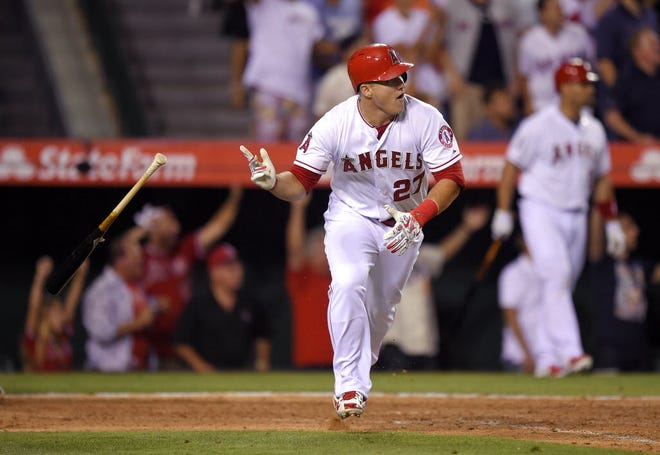 Mike Trout tosses his bat after hitting his walk-off home run Friday night.