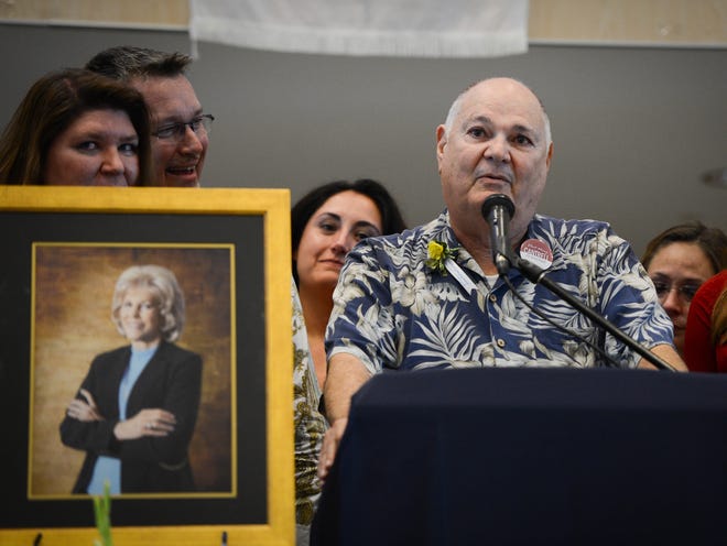 Surrounded by his family at the Celebration of Life for Dr. Mary Cantrell on Saturday, Louis Cantrell, Dr. Cantrell's husband, eulogizes his wife at the Manatee Technical Institute.