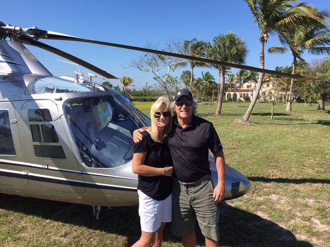 Mark and Cindy Pentecost arrive on Little Bokeelia Island on Tuesday via helicopter for a walk-through inspection.