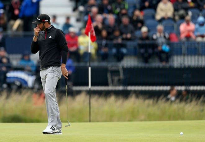 Dustin Johnson reacts on the sixth green during the third round of the British Open Golf Championship at the Old Course, St. Andrews, Scotland, Sunday, July 19, 2015.