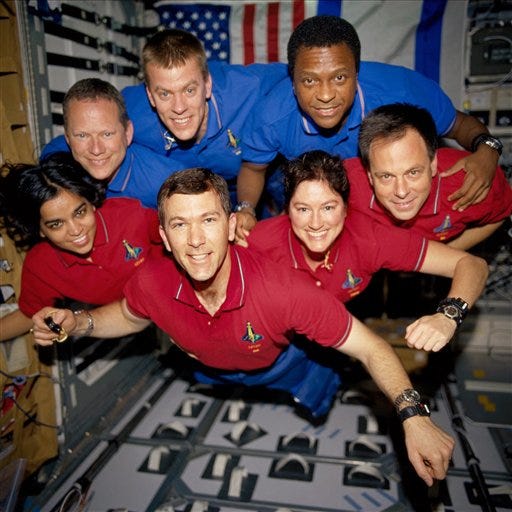ADVANCE FOR USE TUESDAY, JULY 5, 2011 AND THEREAFTER - FILE - This photo provided by NASA in June 2003 shows STS-107 crew members in the SPACEHAB Research Double Module (RDM) aboard the Space Shuttle Columbia. On Feb. 1, 2003, the seven crew members were lost as the Columbia fell apart over East Texas. This picture was on a roll of unprocessed film later recovered by searchers from the debris. From the left (bottom row), wearing red shirts to signify their shift’s color, are astronauts Kalpana Chawla, mission specialist; Rick D. Husband, mission commander; Laurel B. Clark, mission specialist; and Ilan Ramon, payload specialist. From the left (top row), wearing blue shirts, are astronauts David M. Brown, mission specialist; William C. McCool, pilot; and Michael P. Anderson, payload commander. Ramon represents the Israeli Space Agency. (AP Photo/NASA, File)
