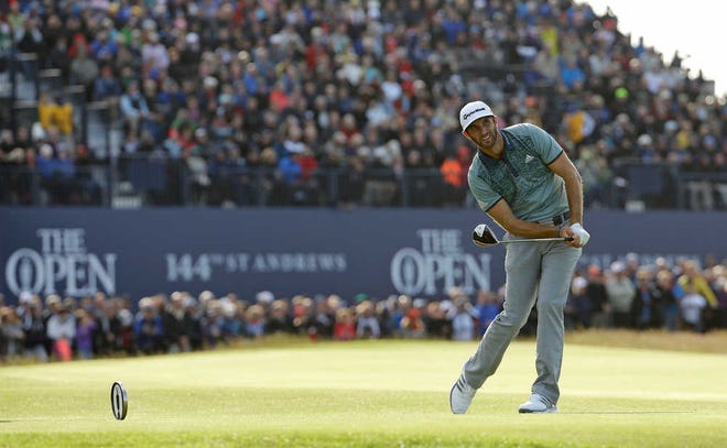 United States' Dustin Johnson follows his drive from the 18th tee during the second round of the British Open Golf Championship at the Old Course, St. Andrews, Scotland, Saturday, July 18, 2015. (AP Photo/David J. Phillip)