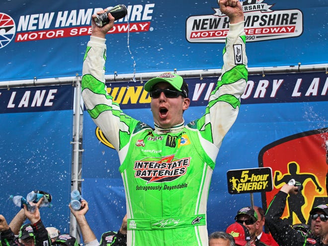 Kyle Busch celebrates in victory lane after winning the NASCAR Sprint Cup series race at New Hampshire Motor Speedway in Loudon, N.H., on Sunday.