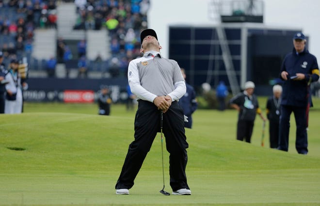 South Africa's Louis Oosthuizen reacts after missing a putt on the 17th during a playoff after the final round at the British Open Golf Championship at the Old Course, St. Andrews, Scotland, Monday, July 20, 2015.