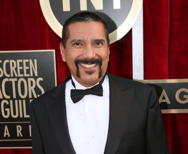 In this Jan. 18, 2014 file photo, Steven Michael Quezada an actor on the series "Breaking Bad," arrives at the 20th annual Screen Actors Guild Awards in Los Angeles. Quezada is jumping in a race for a heated county commissioner seat in Albuquerque. Quezada, who played DEA agent Steven Gomez in the hit AMC-TV series "Breaking Bad", said Monday, July 20, he will announce this week that he will run for the Bernalillo County Commission. (Photo by Matt Sayles/Invision/AP, File)