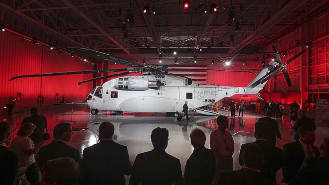 A crowd of interested onlookers attend the official rollout of Sikorsky Aircraft’s newest helicopter – the CH-53K heavy-lift helicopter – for the U.S. Marine Corps, Monday, May 5, 2014. Among other things, officials said the CH-53K can carry 2 pilots, 2 cabin members, and 30 troops, and that it has an external load carrying capacity of 27,000 pounds over a mission radius of 110 nautical miles under high hot ambient conditions. (Damon Higgins/The Palm Beach Post)