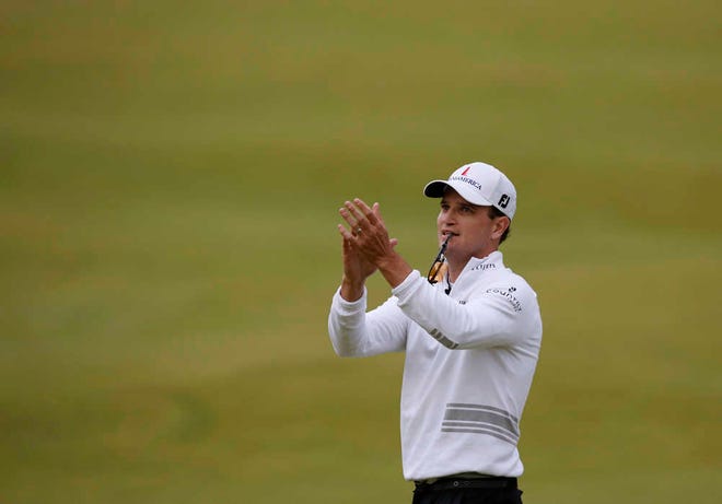 United States' Zach Johnson reacts after winning a playoff after the final round of the British Open Golf Championship at the Old Course, St. Andrews, Scotland, Monday, July 20, 2015. (AP Photo/Jon Super)