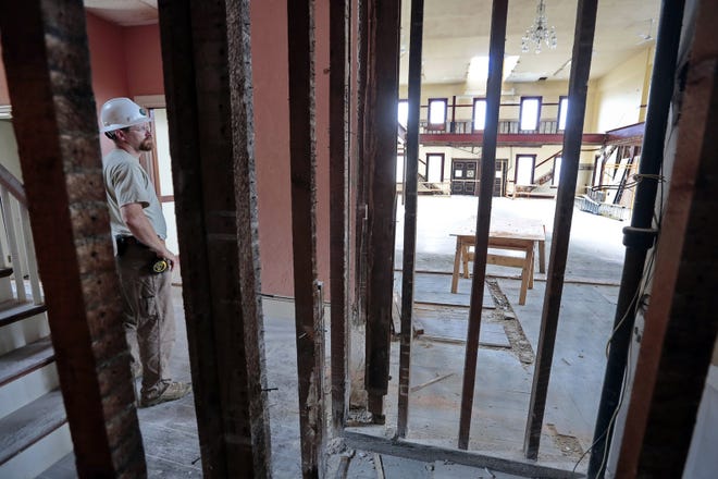 Ed Brown of R.P. Valois looks over some of the work being done at the former Ahavath Achim synagogue on County Street in New Bedford. PETER PEREIRA/THE STANDARD-TIMES